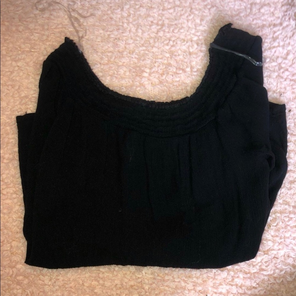 Off the shoulder black long sleeved top.